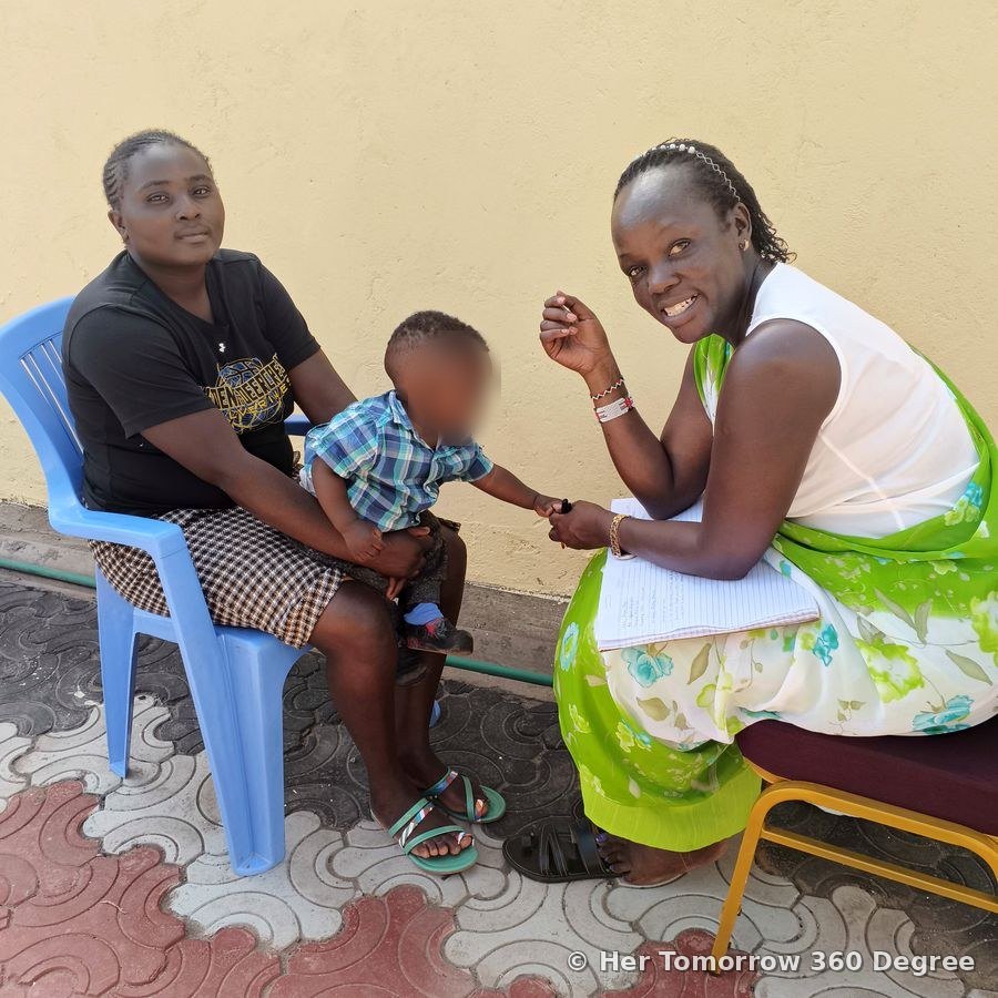 A young mother and her son in a one-to-one skills consultation, both smiling
