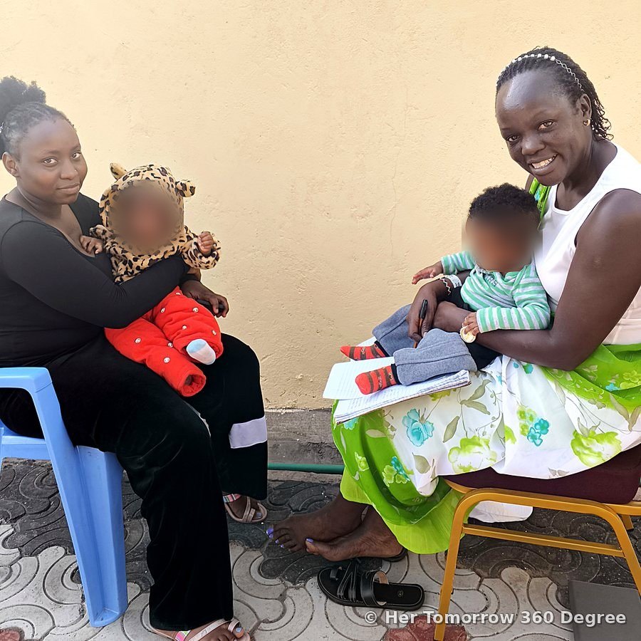 A young mother and Lyma Kivali, each holding a baby, talk about skills