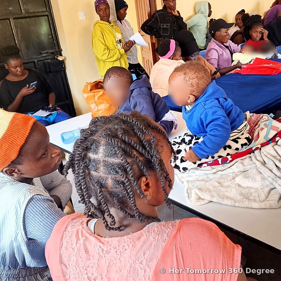 Babies resting on a table while their mothers attend the session